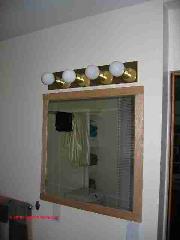 Bathroom lighting over small mirror (C) Daniel Friedman